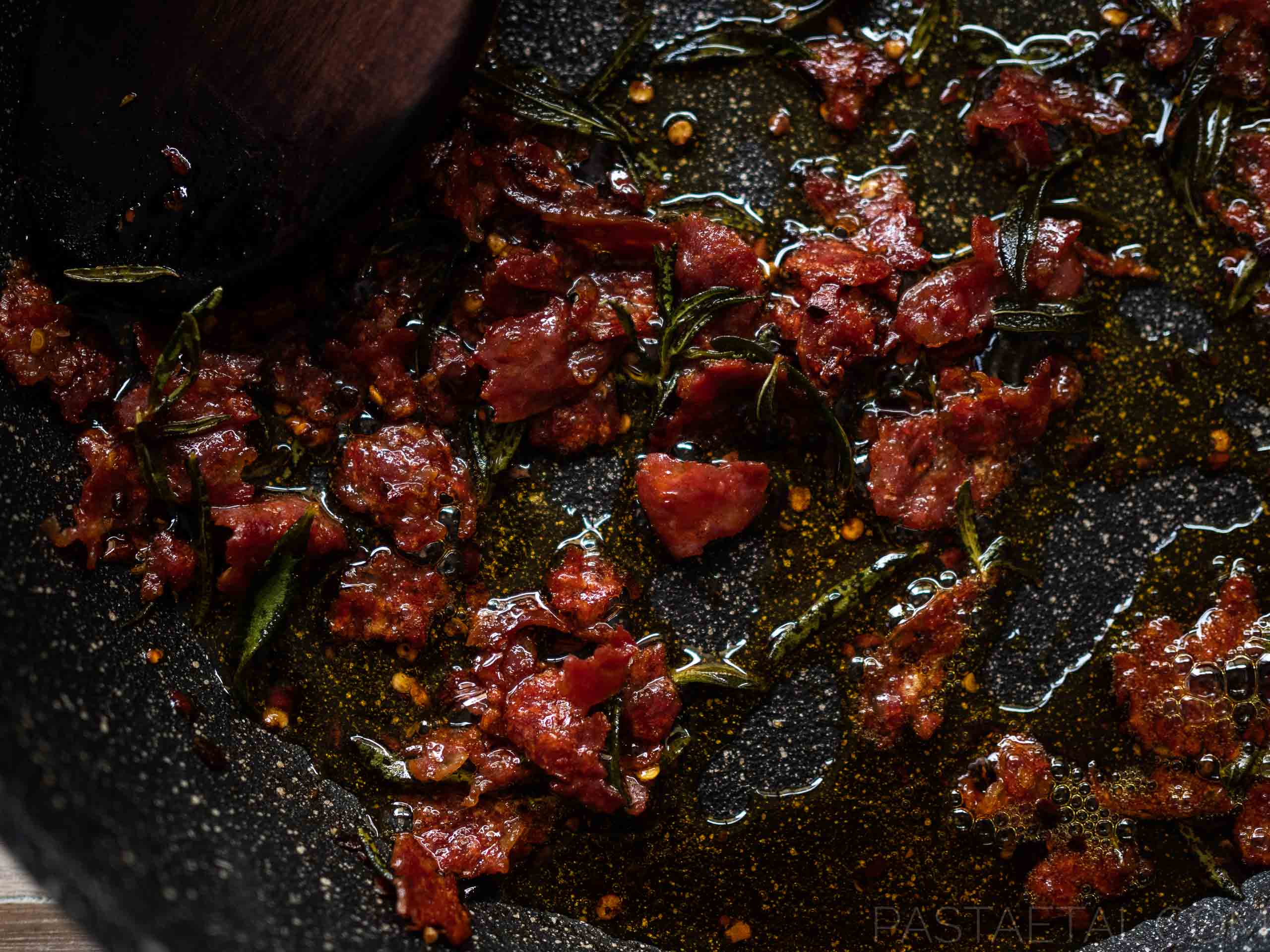 https://pastaetal.com/wp-content/uploads/2020/05/sliced-chorizo-and-rosemary-frying-in-olive-oil.jpg