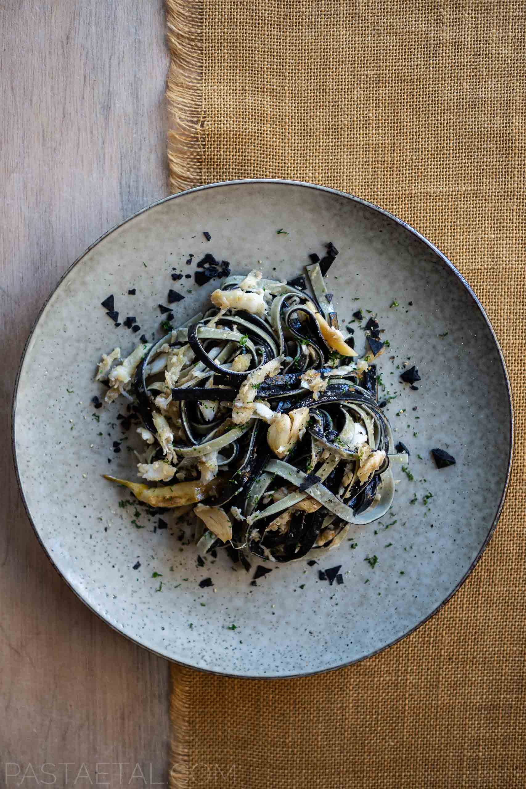 https://pastaetal.com/wp-content/uploads/2020/07/blog-main-pasta-et-al-plate-of-laminated-squid-ink-and-lemon-linguine-with-whitebait-and-black-sea-salt.jpg