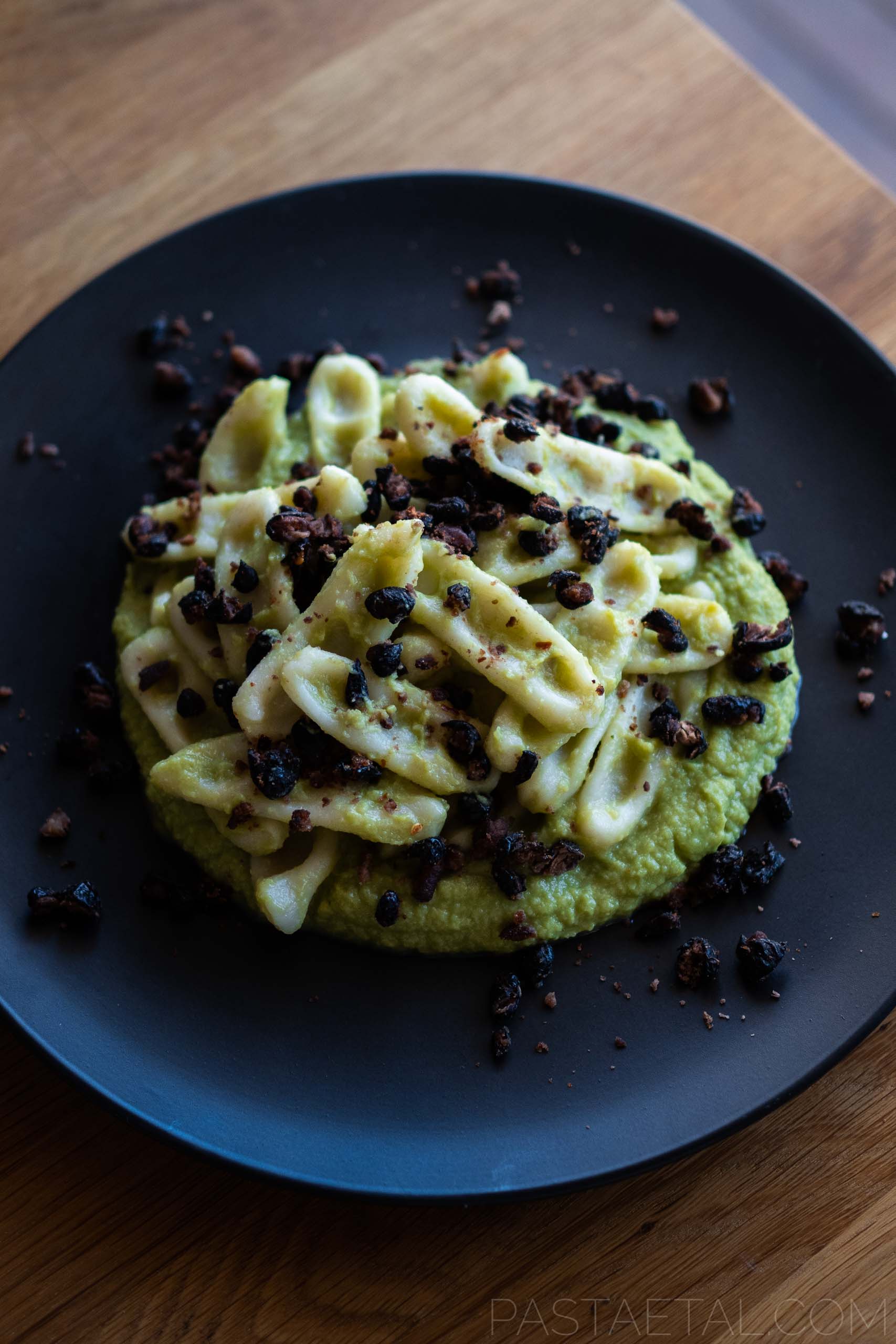 https://pastaetal.com/wp-content/uploads/2021/05/angled-photo-of-capunti-pasta-served-with-broccoli-puree-and-chilli-roasted-black-beans.jpg