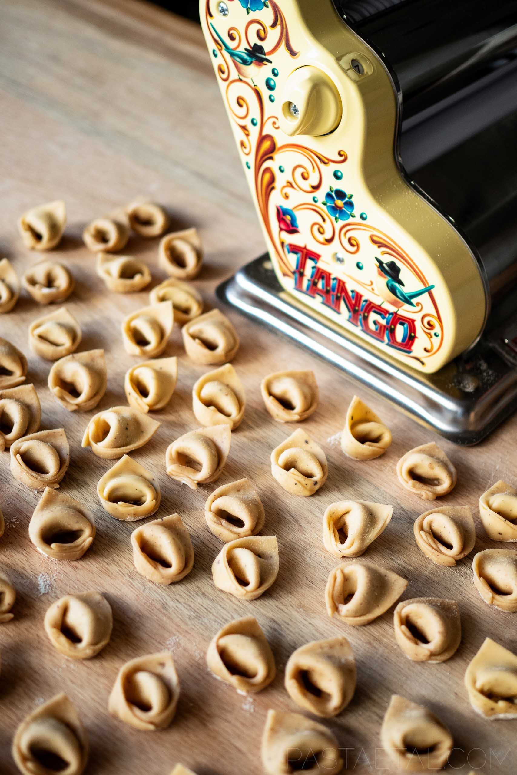 https://pastaetal.com/wp-content/uploads/2023/09/Tortellini-in-Front-of-Pastalinda-Pasta-Machine.jpg